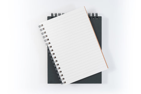 school notebook on a white background, spiral notepad on a table