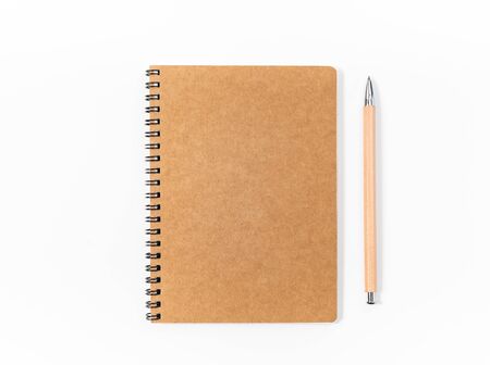 Brown spiral notebook isolated on white background. Top viewの写真素材