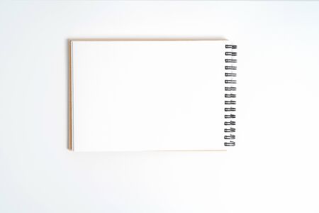 A notebook on a spring. Isolated on white background.の写真素材