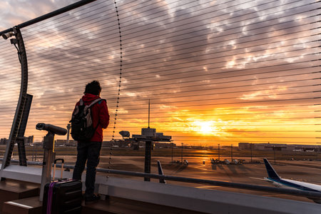 People silhouette outside Observation Deck. Tokyo International Airport at sunrise / sunset panorama, Haneda Airport in Tokyo, Japan.のeditorial素材