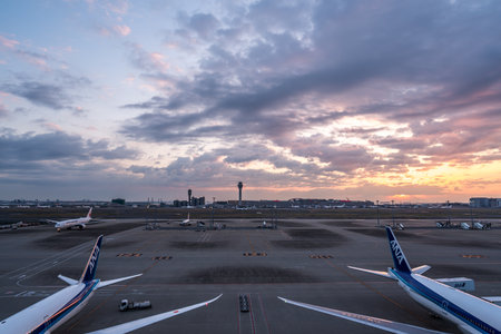 Tokyo, Japan - March 25, 2019. Tokyo International Airport at sunrise / sunset panorama, Haneda Airport in Tokyo, Japan.のeditorial素材
