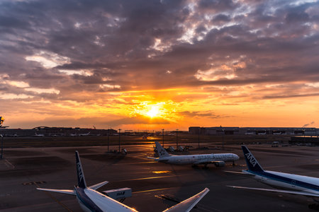 Tokyo, Japan - March 25, 2019. Tokyo International Airport at sunrise / sunset panorama, Haneda Airport in Tokyo, Japan.のeditorial素材