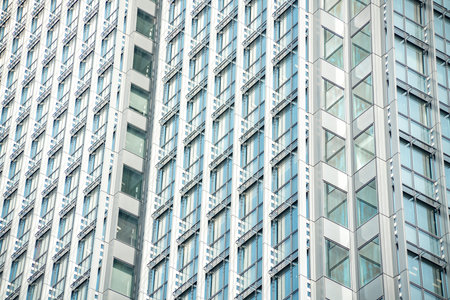Unique low angle building perspective. bright sun reflecting on the glass of the modern building. shot in the netherlands.のeditorial素材