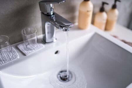 Modern bathroom faucet, Very high end faucet, sink, and counter in a luxury bathroomの写真素材