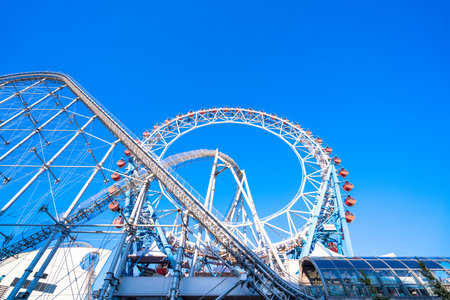 Tokyo Japan - November 16, 2019: Tokyo Dome City includes an amusement park and Tokyo Dome City Attractions occupies the former Korakuen Stadium and includes a roller coaster and a hubless Ferris wheelのeditorial素材