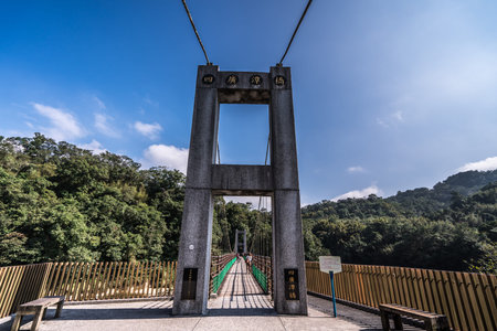 Jingan Suspension bridge near shihfen waterfall, Pingxi District, Taiwan. Shifen is a small town...