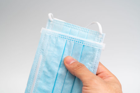 Protective face mask on white background