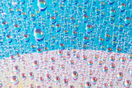 water drops on dvd media, water drops on colorful backgroundの写真素材