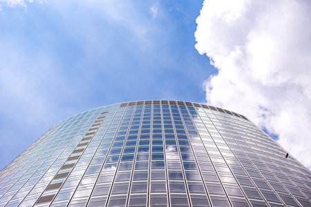 underside panoramic and perspective view to steel blue glass high rise building skyscrapers,...