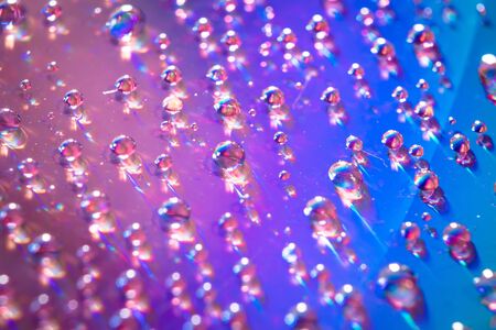 water drops on dvd media, water drops on colorful backgroundの写真素材