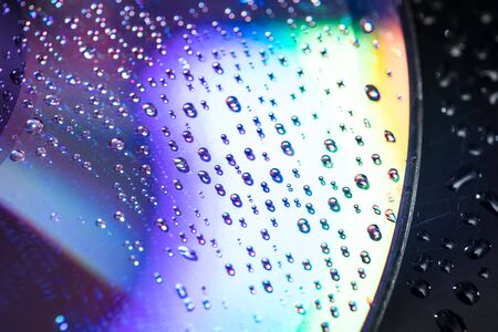 water drops on dvd media, water drops on colorful backgroundの写真素材