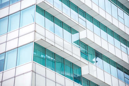 underside panoramic and perspective view to steel blue glass high rise building skyscrapers, business concept of successful industrial architectureの写真素材