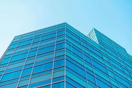 underside panoramic and perspective view to steel blue glass high rise building skyscrapers, business concept of successful industrial architectureの写真素材