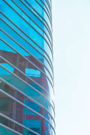 underside panoramic and perspective view to steel blue glass high rise building skyscrapers, business concept of successful industrial architectureの写真素材