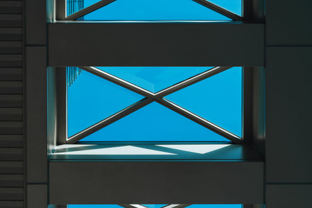 underside panoramic and perspective view to steel blue glass high rise building skyscrapers,...