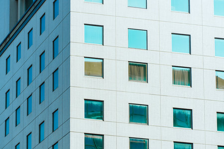 underside panoramic and perspective view to steel blue glass high rise building skyscrapers,...