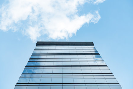 underside panoramic and perspective view to steel blue glass high rise building skyscrapers, business concept of successful industrial architectureのeditorial素材