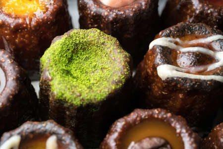 Caneles de bordeaux is a small pastry with rum and vanilla, traditional French sweet dessert.の写真素材