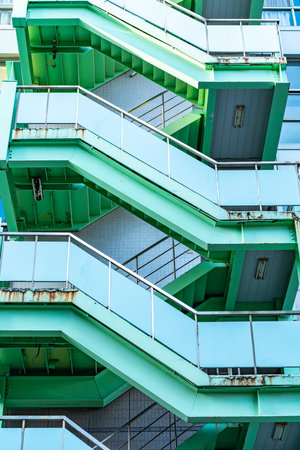 green fire escape ladders on building, Exterior viewのeditorial素材