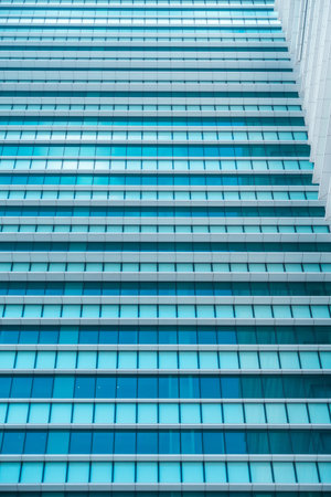 underside panoramic and perspective view to steel blue glass high rise building skyscrapers,...
