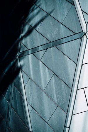 underside panoramic and perspective view to steel blue glass high rise building skyscrapers, business concept of successful industrial architectureの写真素材