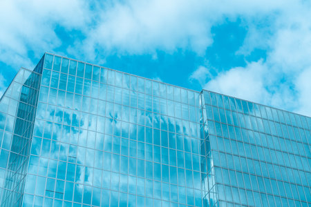 underside panoramic and perspective view to steel blue glass high rise building skyscrapers,...