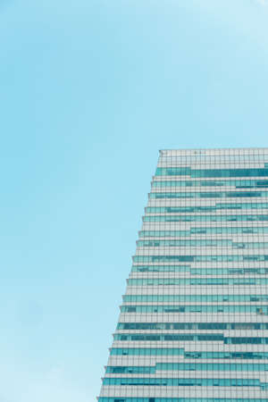 underside panoramic and perspective view to steel blue glass high rise building skyscrapers, business concept of successful industrial architectureの写真素材