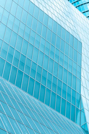 underside panoramic and perspective view to steel blue glass high rise building skyscrapers, business concept of successful industrial architectureの写真素材