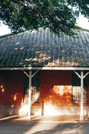 An old red brick house close-up. Morning fog. Country landscape.のeditorial素材