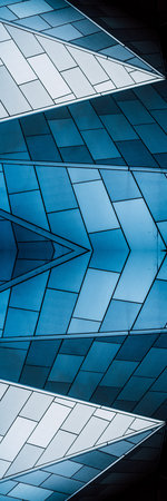 underside panoramic and perspective view to steel blue glass high rise building skyscrapers,...