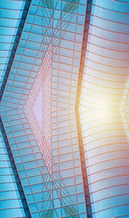underside panoramic and perspective view to steel blue glass high rise building skyscrapers, business concept of successful industrial architectureの写真素材