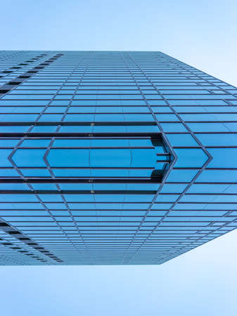 underside panoramic and perspective view to steel blue glass high rise building skyscrapers, business concept of successful industrial architectureの写真素材