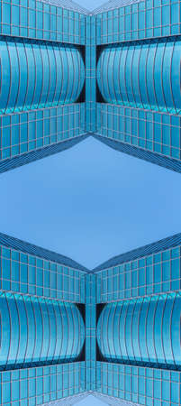 underside panoramic and perspective view to steel blue glass high rise building skyscrapers, business concept of successful industrial architectureの写真素材