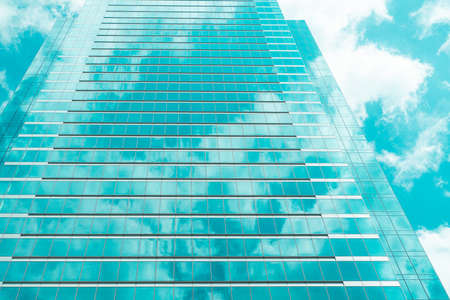 underside panoramic and perspective view to steel blue glass high rise building skyscrapers, business concept of successful industrial architectureの写真素材