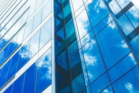 underside panoramic and perspective view to steel blue glass high rise building skyscrapers,...