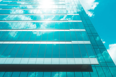 underside panoramic and perspective view to steel blue glass high rise building skyscrapers,...