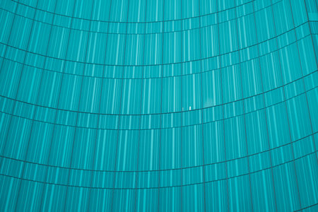 underside panoramic and perspective view to steel blue glass high rise building skyscrapers, business concept of successful industrial architectureの写真素材