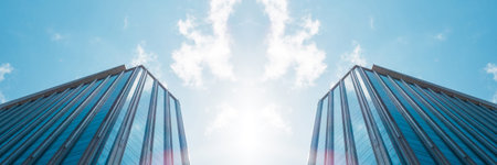 underside panoramic and perspective view to steel blue glass high rise building skyscrapers,...