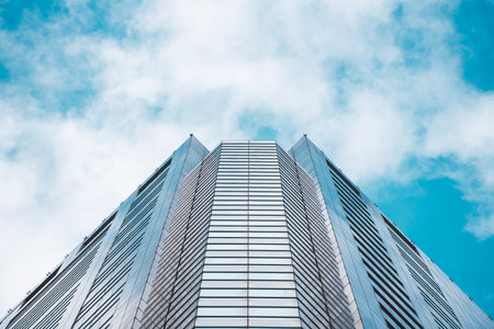 underside panoramic and perspective view to steel blue glass high rise building skyscrapers, business concept of successful industrial architectureの写真素材