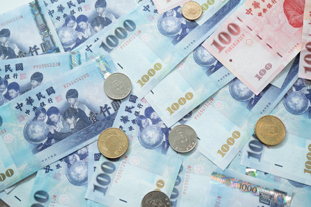 New Taiwan Dollar bill on white background. Red envelope packet chinese new year, hongbao on white background.の写真素材