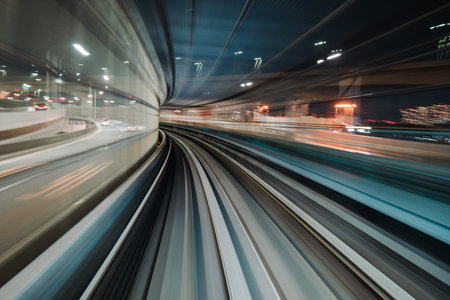 Motion blurred train moving inside tunnel with daylight in tokyo, japan.の写真素材