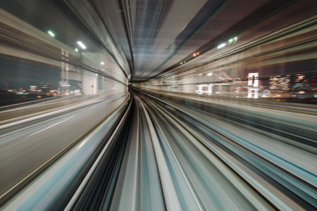 Motion blurred train moving inside tunnel with daylight in tokyo, japan.の写真素材