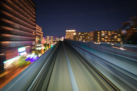 Motion blurred train moving inside tunnel with daylight in tokyo, japan.の写真素材