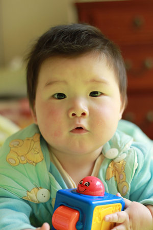 lovely chinese baby playing toy 