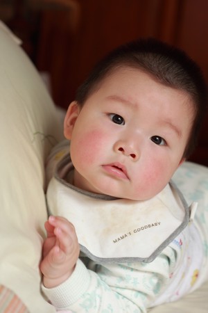 baby in bedの写真素材