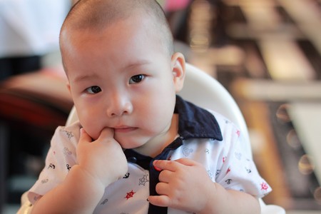 Asian boy sucking fingerの写真素材