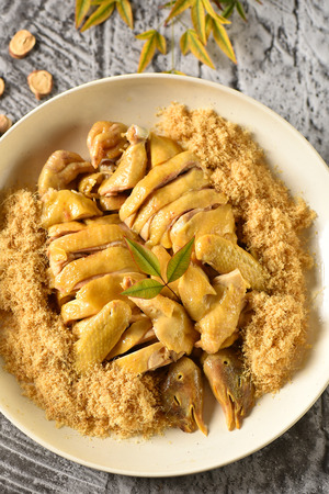 Chicken with ginger from garlic in a white plateの写真素材