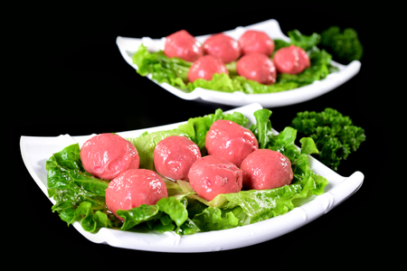 Fresh handmade beef meatballs in a white dishの写真素材