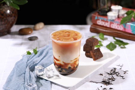 Brown sugar latte in a cupの写真素材