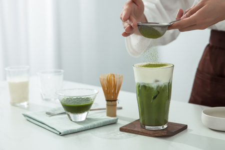 A man is making snow top maccha smoothiesの写真素材